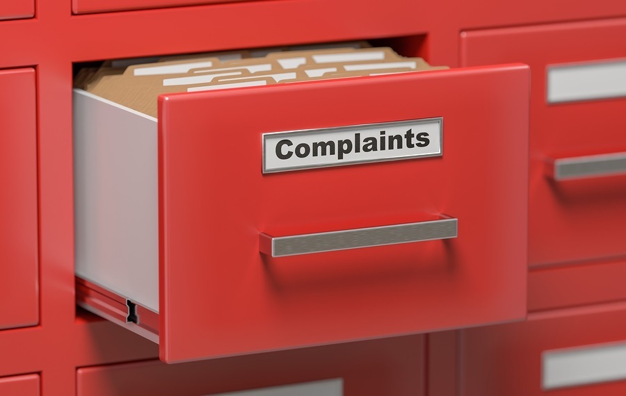Complaints filed in filing cabinet. 3D rendered illustration.