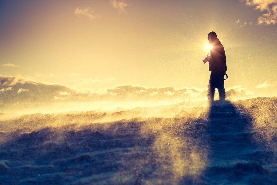 Hiker standing on top of a mountain. Dramatic scenery. Carpathian, Ukraine, Europe. Beauty world.